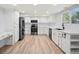 Spacious kitchen features modern appliances, light cabinets, and a light floor at 2090 S Fairplay St, Aurora, CO 80014
