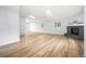 Spacious living room boasts sleek floors, ample natural light, and a cozy fireplace at 2090 S Fairplay St, Aurora, CO 80014