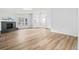 Bright living room featuring sleek floors, vaulted ceilings, skylights, and a cozy fireplace at 2090 S Fairplay St, Aurora, CO 80014