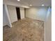 Basement featuring unfinished flooring, open space, and access to utility area at 3984 S Pitkin Way, Aurora, CO 80013