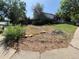 A home with a lot that needs landscaping work but has a covered front porch at 3984 S Pitkin Way, Aurora, CO 80013