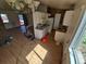Open floor plan with a view of the kitchen; shows a range, refrigerator, and undermount sink at 3984 S Pitkin Way, Aurora, CO 80013