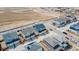 Aerial view showcases a neighborhood featuring modern homes and manicured streets at 21821 E 7Th Ave, Aurora, CO 80018