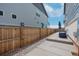 Backyard patio area with wood fence, and space for an outdoor umbrella at 21821 E 7Th Ave, Aurora, CO 80018