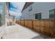 Backyard patio area with wood fence and space for outdoor seating at 21821 E 7Th Ave, Aurora, CO 80018