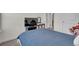 Bedroom featuring neutral carpet, TV, a vanity and a convenient door to the hallway at 21821 E 7Th Ave, Aurora, CO 80018