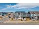 Charming two-story home with a covered front porch, a well manicured lawn, and an attractive red door at 21821 E 7Th Ave, Aurora, CO 80018
