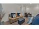 Inviting living area with neutral tones, complemented by comfortable seating and a functional workspace at 21821 E 7Th Ave, Aurora, CO 80018