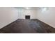 Spacious carpeted basement featuring a fireplace and natural light at 30 Eudora St, Denver, CO 80220