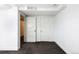 Clean basement featuring painted white walls, gray carpet and convenient door access at 30 Eudora St, Denver, CO 80220