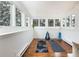 Bright bonus room featuring wood floors, yoga mats, and large windows at 30 Eudora St, Denver, CO 80220