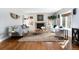 Cozy living room with neutral tones, hardwood floors, fireplace, and large windows for natural light at 30 Eudora St, Denver, CO 80220
