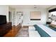 Bright main bedroom shows access to walk-in closet, plush decor, and art on the wall at 30 Eudora St, Denver, CO 80220