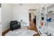 Bright office space with hardwood floors features modern shelving and easy access to other spaces at 30 Eudora St, Denver, CO 80220