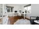 Bright office space with hardwood floors features dual white desk stations and modern decor at 30 Eudora St, Denver, CO 80220