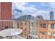 Cozy balcony featuring a bistro set and cityscape views at 1700 Bassett St # 412, Denver, CO 80202