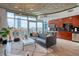 Open concept living room featuring floor-to-ceiling windows and modern kitchen with stainless appliances at 1700 Bassett St # 412, Denver, CO 80202