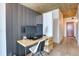 Office space with modern desk, chair and storage along hallway at 1700 Bassett St # 412, Denver, CO 80202