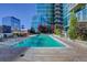 Sparkling pool at building featuring lounge areas and city views at 1700 Bassett St # 412, Denver, CO 80202