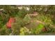 Overhead view showcases charming cabin nestled by a river and lush trees at 35106 Boulder Canyon Dr, Boulder, CO 80302