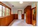 Cozy bedroom featuring carpet, natural light, and paneled walls with built-in storage at 35106 Boulder Canyon Dr, Boulder, CO 80302