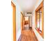 Hallway featuring hardwood floors and wood trim, leading to other rooms at 35106 Boulder Canyon Dr, Boulder, CO 80302