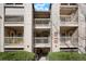 Well-maintained apartment building entrance featuring stairwells and multiple levels with balconies at 9212 E Arbor Cir # E, Englewood, CO 80111