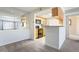 Cozy kitchen with ample cabinet space and a view of the living area at 9212 E Arbor Cir # E, Englewood, CO 80111