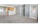 Open-concept living room featuring neutral carpet and modern finishes at 9212 E Arbor Cir # E, Englewood, CO 80111
