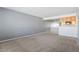 Bright living room with neutral tones and an open layout concept leading to the kitchen at 9212 E Arbor Cir # E, Englewood, CO 80111
