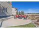 Enjoy outdoor living on this backyard patio with a cozy fire pit and comfortable seating for entertaining at 8016 Gore Creek Ln, Littleton, CO 80125