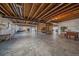 Spacious unfinished basement with high ceilings and visible ceiling structure offers plenty of room to customize at 8016 Gore Creek Ln, Littleton, CO 80125