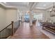 Open-concept foyer with wood floors leading to the living room and dining area at 8016 Gore Creek Ln, Littleton, CO 80125