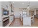 Stylish white kitchen with a center island, stainless steel appliances, and pendant lighting at 8016 Gore Creek Ln, Littleton, CO 80125