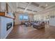 Comfortable living room with a fireplace, coffered ceiling, and large windows at 8016 Gore Creek Ln, Littleton, CO 80125