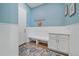 Functional mudroom with built-in bench, storage cabinets, coat hooks, and stylish rug at 8016 Gore Creek Ln, Littleton, CO 80125