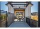 Well-equipped outdoor kitchen with built-in grill, stainless steel counters, and seating area for perfect for entertaining at 8016 Gore Creek Ln, Littleton, CO 80125
