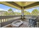 Relaxing balcony with mountain views, outdoor seating, and dog bed at 6435 Spotted Fawn Run, Littleton, CO 80125