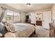 Cozy bedroom with an ensuite bathroom and bright natural light at 6435 Spotted Fawn Run, Littleton, CO 80125