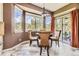 An eat-in-kitchen dining area with a round table and scenic views at 6435 Spotted Fawn Run, Littleton, CO 80125