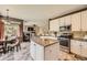 A kitchen with granite countertops, stainless steel appliances, and a kitchen island with seating at 6435 Spotted Fawn Run, Littleton, CO 80125