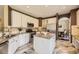 Stylish kitchen with white cabinets, granite countertops, and stainless steel appliances at 6435 Spotted Fawn Run, Littleton, CO 80125