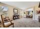 Inviting living room with neutral tones, classic furniture, and a view of the dining area at 6435 Spotted Fawn Run, Littleton, CO 80125