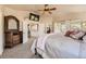 Beautiful main bedroom features carpeted floors and deck access with views at 6435 Spotted Fawn Run, Littleton, CO 80125