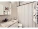 Bright bathroom with granite countertop, modern fixtures, and shower with white subway tile surround at 17720 Weymouth Ave, Parker, CO 80134