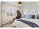 Comfortable bedroom featuring bright natural light, neutral decor, and a ceiling fan at 17720 Weymouth Ave, Parker, CO 80134