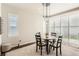 Charming dining area featuring a modern light fixture and bright shuttered windows at 17720 Weymouth Ave, Parker, CO 80134
