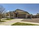 Lovely single-story home with manicured lawn, two-car garage, and neutral exterior paint at 17720 Weymouth Ave, Parker, CO 80134