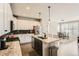 Bright kitchen with granite counters, stainless steel appliances, and an open floor plan at 17720 Weymouth Ave, Parker, CO 80134