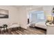 Nicely decorated bedroom with gray and white furniture at 2060 W Iliff Ave, Englewood, CO 80110